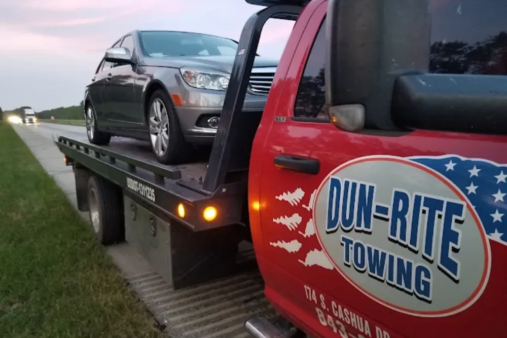 Towing service with a car on truck