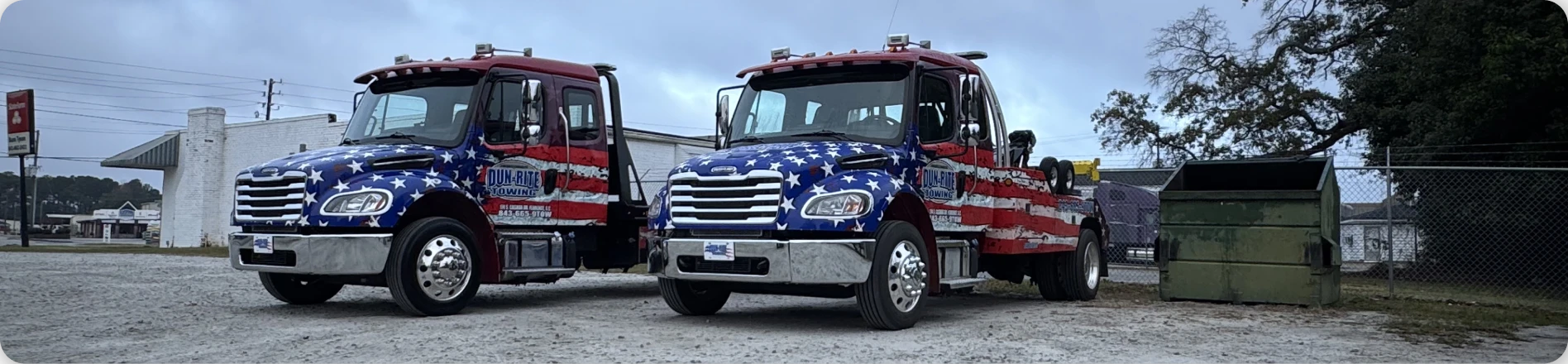 Two trucks with American flag design