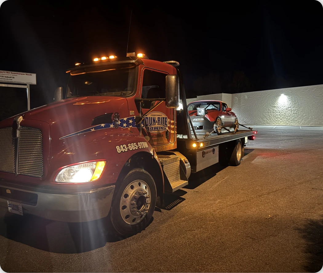 Tow truck with a car loaded