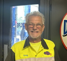 Smiling man in work uniform.
