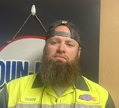 Man with beard in work uniform
